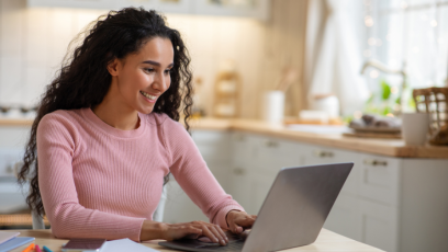 A woman working remotely on her laptop