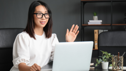 Women speaking into laptop video