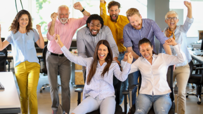 Co-workers having a great time at work together.