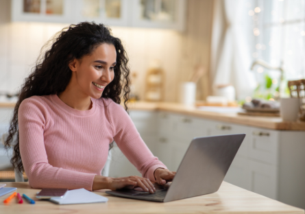 A woman working remotely on her laptop