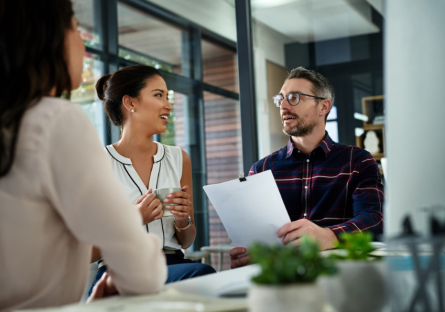 Employees receiving feedback from manager