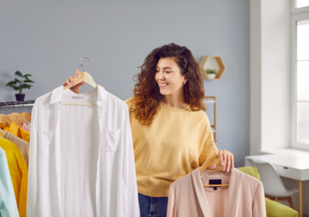 A woman choosing her clothing for an interview. 