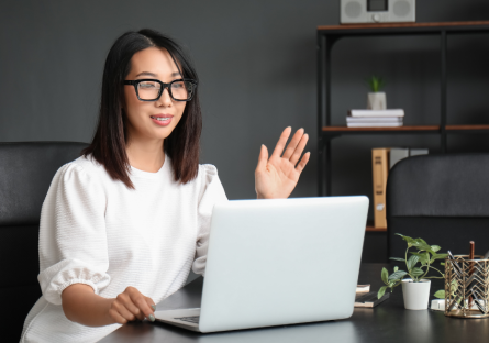 Women speaking into laptop video