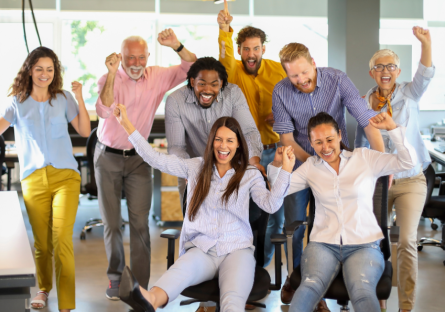 Co-workers having a great time at work together.