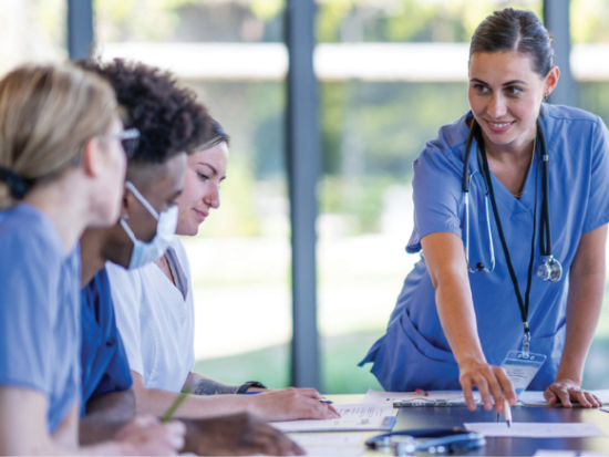 Female nurses having a meeting at a table