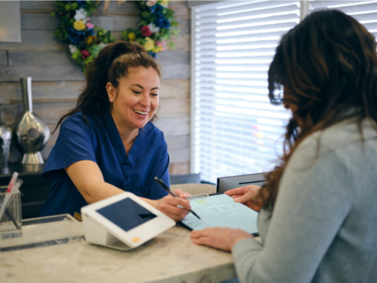 Woman providing client information on paper sheet