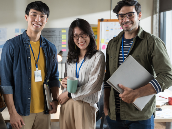 Three smiling business professionals