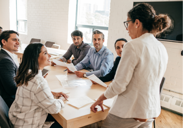 Woman leading a conversation among coworkers