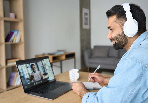 Man on Zoom meeting on his laptop