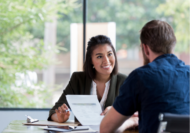 Woman and men in small meeting