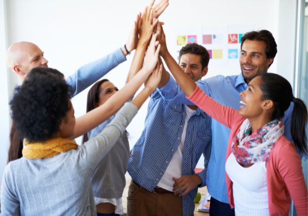 Group of coworkers doing a group high five