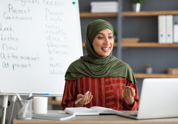 Woman speaking with colleagues on laptop