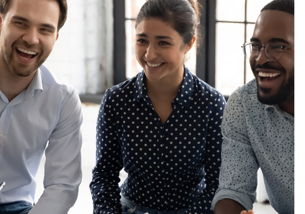 Three business professionals laughing together